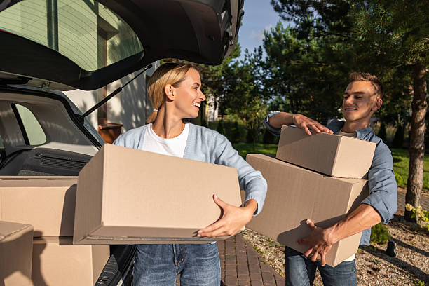 istock Young couple packing clothes into boxes and getting prepared for the moving in 2221675423