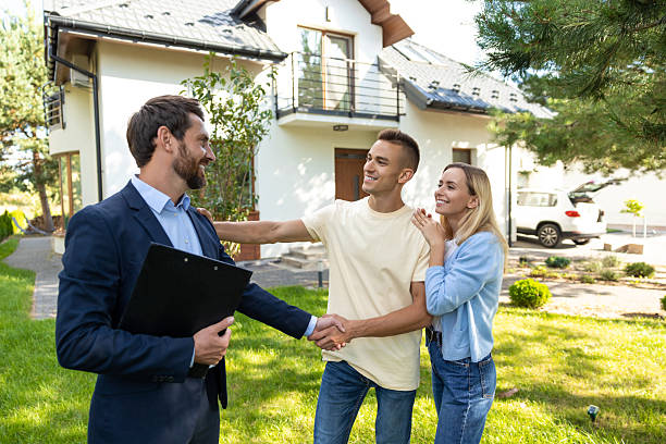 istock Real state agent talking to the clients after a successful deal 2221675443