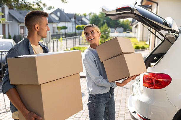 istock Two young people looking involved while packing for the moving to a new location 2221676198