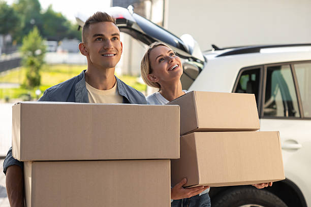 istock Two young people looking involved while packing for the moving to a new location 2221676207