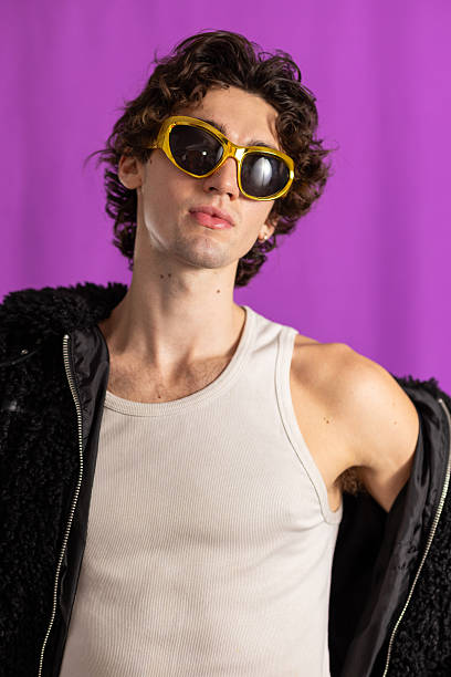 istock Stylish Young Man in Gold Sunglasses 2221678984