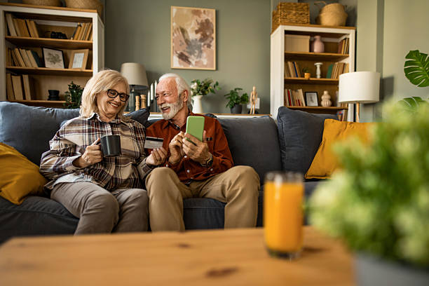 istock Happy senior couple using internet banking at home 2221681775