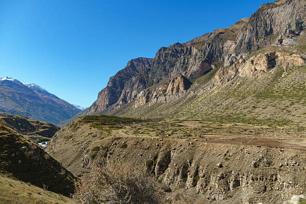 istock Rugged mountain landscape with steep cliffs and rocky terrain under clear blue sky, showcasing the raw beauty of nature.Kabardino-Balkaria, Chegemsky district 2221682397