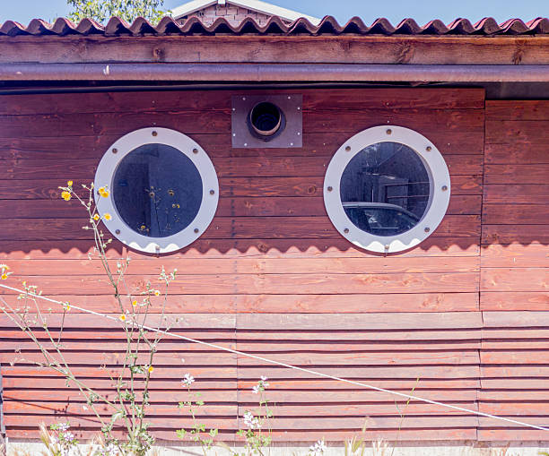 Wooden house with round windows