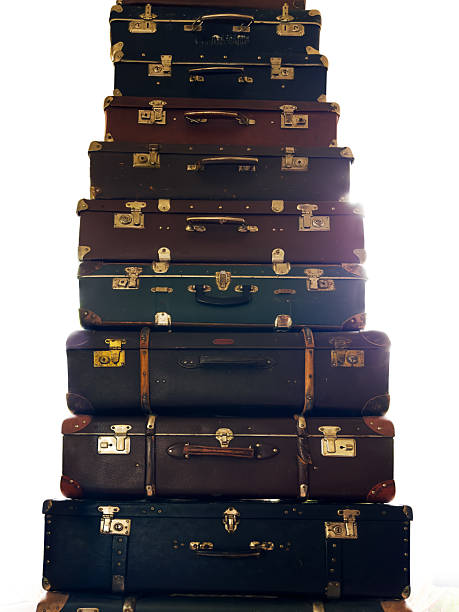 istock High stack of old shabby leatherette suitcases of different sizes 2221685214