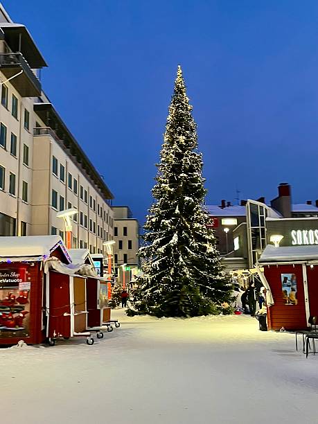 Finland - Rovaniemi - city center The tiny city center of Rovaniemi, snow-covered, with its Christmas tree and Christmas decorations. In this photo, it is 3 PM but as we can see, it is already night. We are in December.December 21, 2024