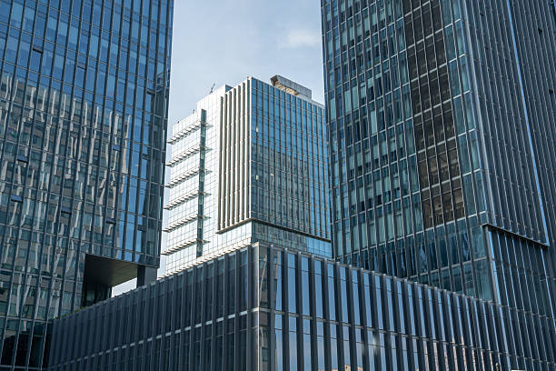 istock modern office building exterior with  glass windows, business background and empty copy space. 2221687699