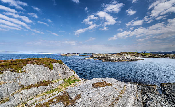 istock Scenic Coastal Boardwalk Overlooking the Ocean Under a Vibrant Blue Sky, Atlantic Highway, Norway 2221687795
