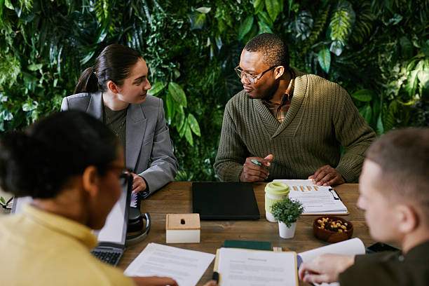 istock Multiethnic Young Adults Collaborating during Business Meeting at Office Table 2221688062
