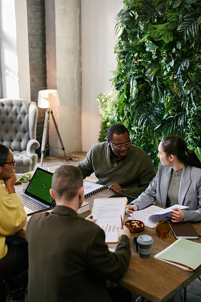 istock Middle Aged Black Man Leading Multiethnic Team Brainstorming Business Solutions 2221688066