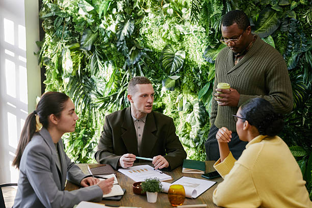 istock Young Adult Multiethnic Business Team Analyzing Financial Data Together 2221688075