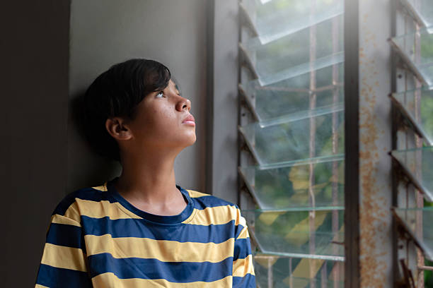 istock Asian boy in sad mood 2221688125