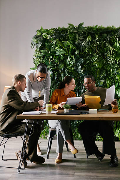 istock Multiethnic Business Professionals Reviewing Financial Documents during Teamwork 2221688222