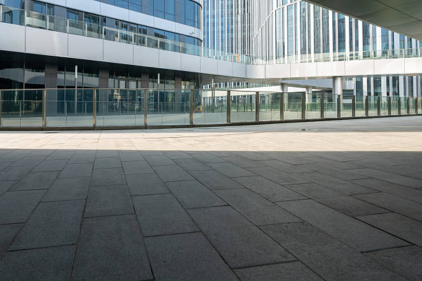 istock empty ground floor with modern cityscape and office buildings. 2221689118