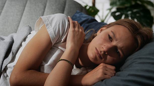 istock Concerned Young Woman Relaxing On Comfortable Sofa 2221689214