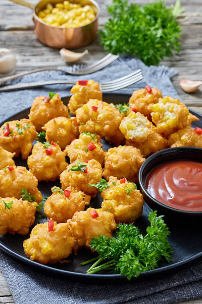 istock corn nuggets on a plate with tomato sauce 2221690181