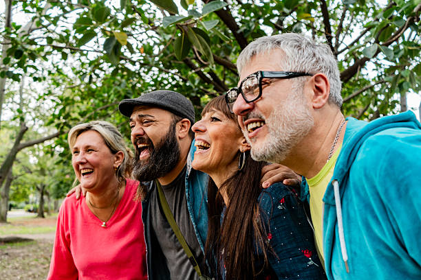istock Friends talking in a public park 2221690475