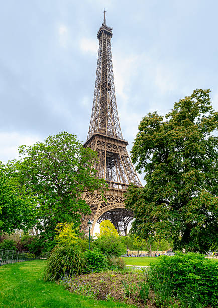 istock Iconic View of the Eiffel Tower Surrounded by Lush Green Park 2221691854