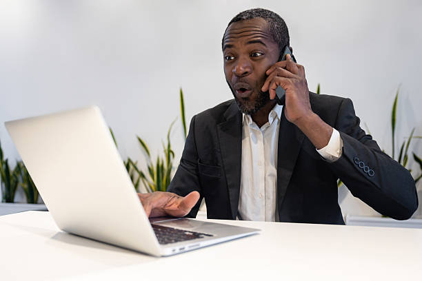 Good deal. Businessman having a phone call and feeling excited and positive