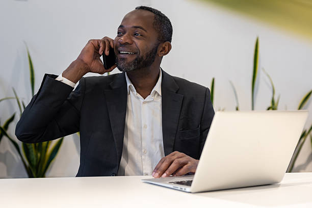istock Businessman having a phone call and smiling positively 2221692280