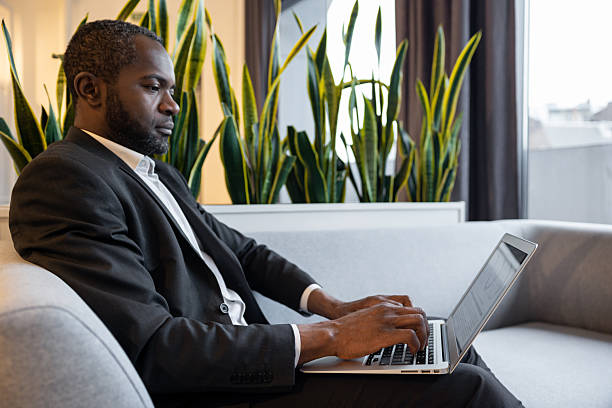 istock Confident businessman working on a laptop and looking involved 2221692563