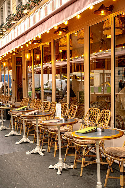 istock Outdoor Parisian Cafe With Chairs and Tables on Sidewalk 2221692909