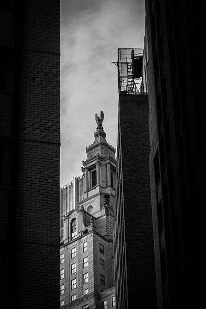 istock Classic Manhattan Tower Framed by Shadows in Black and White Perspective 2221693620