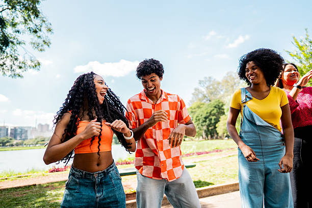 istock Friends dancing on public park 2221694136
