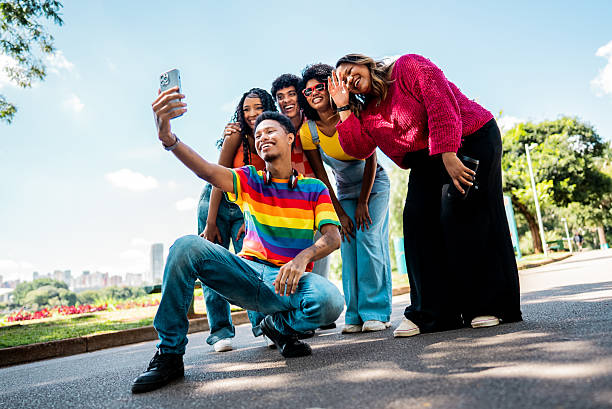 istock Friends taking a selfie using mobile phone on a public park 2221694201