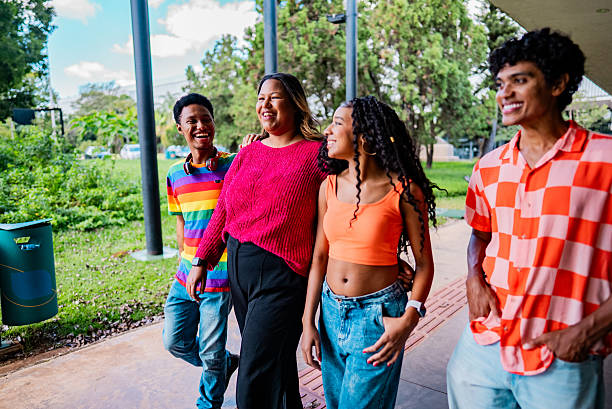 istock Friends talking and walking outdoors 2221694278