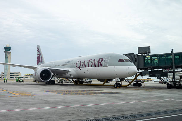 Doha, Qatar - February 24, 2025 : Qatar Airways Boeing 787-9 Dreamliner at the Hamad International Airport in Doha, Qatar.