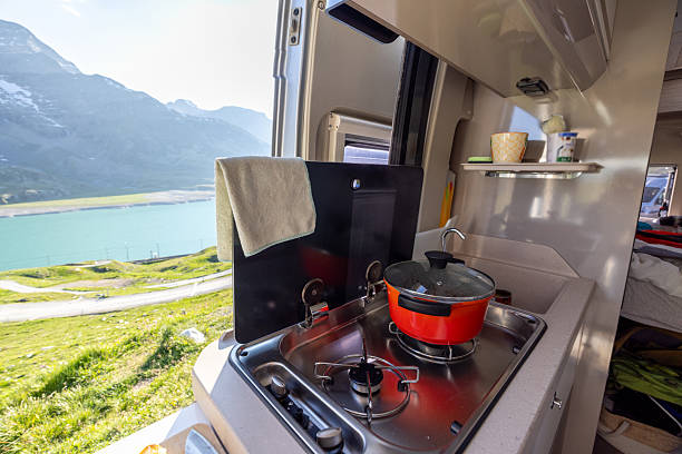 istock Cooking in a Camper Van with Mountain View 2221695933