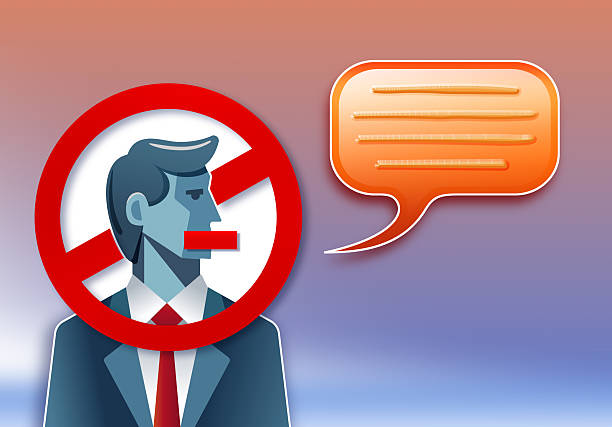 istock Businessman forbidden to speak with speech bubble as metaphor for censorship and dictatorship 2221696149