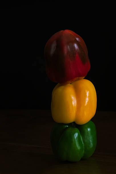 Three peppers vertically in the colors of a traffic light.