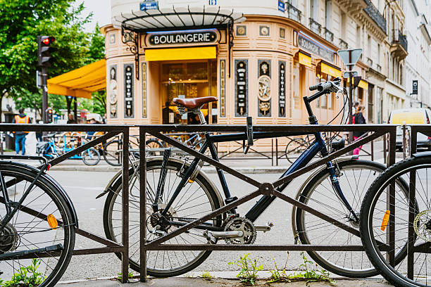 friendly and competent bicycle mechanic in a workshop repairs a bike