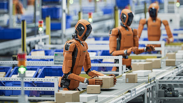 istock 3D Render: Autonomous AI-Enabled Humanoid Robot Working at Fulfillment Center. He is Moving Boxes and Sorting Packages. Automated Warehouse or Logistics Center with General Purpose Humanoid Robots 2221698889
