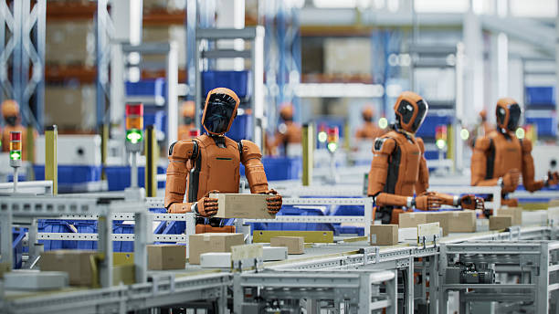 istock 3D Render: Autonomous AI-Enabled Humanoid Robots Work at Fulfillment Center. They are Move Boxes and Sort Packages. Automated Warehouse or Logistics Center with General Purpose Humanoid Robots 2221698890
