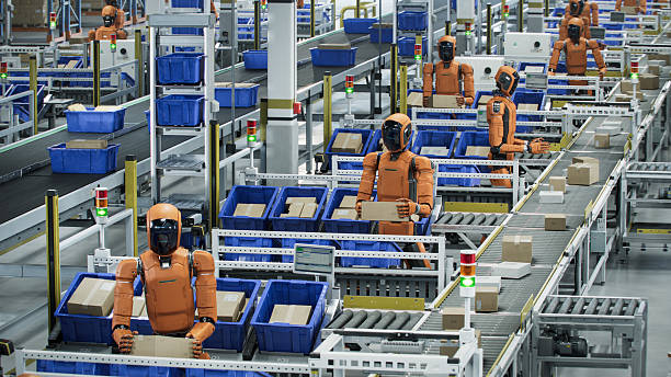 istock 3D Render: Automated Warehouse or Logistics Center with Rows General Purpose Humanoid Robots. Autonomous AI-Enabled Humanoid Robots are Sorting Packages at Fulfillment Center 2221698920