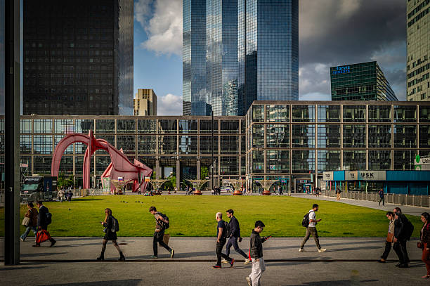 France, La Défense, June 4, 2025. People walk at la Defense.