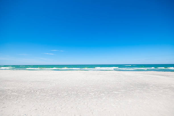 istock Sandy beach and sea waves by sunny summer day 2221707569