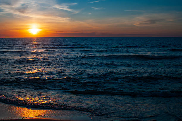 istock Beautiful colorful sunset in cloud sky at tranquil sea 2221707741