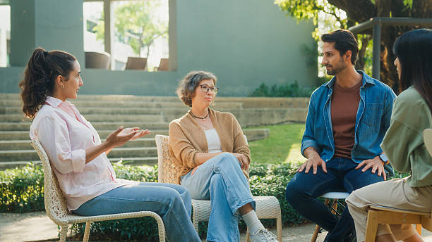 istock Diverse group people participating in outdoor community therapy session focused on mental health awareness and support sharing advice to promote empathy togetherness. Mental health concept. 2221707883