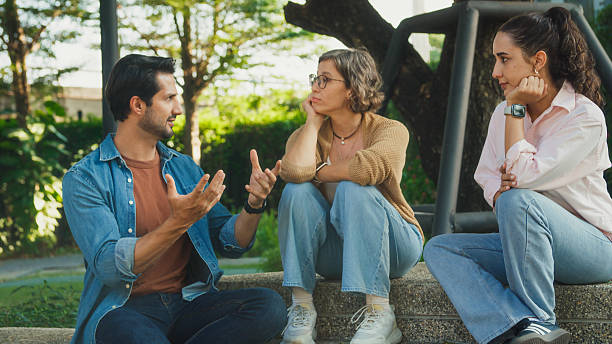 istock Diverse group people participating in outdoor community therapy session focused on mental health awareness and support sharing advice to promote empathy togetherness. Mental health concept. 2221707984