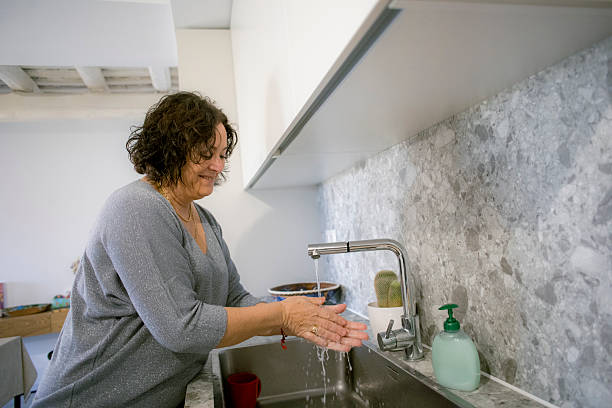 istock Woman washing her hands 2221708674