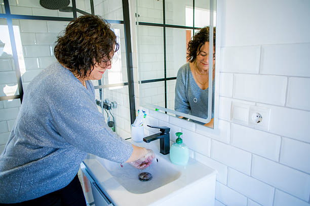 istock Woman washing her hands 2221709887