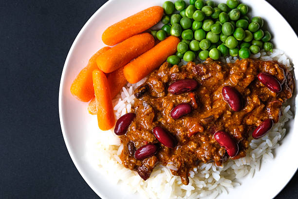 London UK, June23 2025, Mexican Style Chilli Con Carne With Carrots And Garden Peas