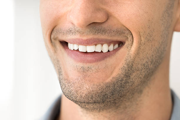 istock Lower part handsome young man face with healthy toothy smile 2221720340