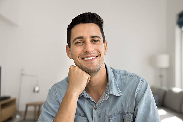 istock Webcam view portrait smiling confident young man making video call 2221720909