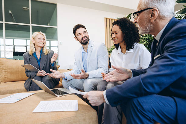 istock Happy multinational managers having meeting discussing project in office 2221723384