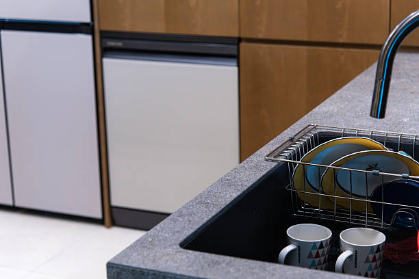 istock cup and dish at the sink in kitchen 2221723543